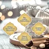 A cozy scene with a mug of tea, decorated with festive lights and natural elements like dried oranges and pinecones. Produktbild-Vorschau