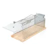 A live trap for rodents, made of metal and wood, set against a white background. Produktbild-Vorschau