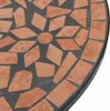 A close-up view of a mosaic tabletop with terracotta tiles arranged in a floral pattern on a black background. Anteprima dell’immagine prodotto