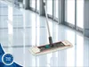 A Leifheit Professional flat mop system is shown on a shiny, reflective floor in a modern building with large glass windows. Produktbild-Vorschau