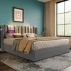 A bedroom scene featuring a bed with a tufted headboard, bedside tables, and a window with curtains. Náhľad obrázku produktu