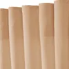 A close-up view of several beige curtains hanging vertically. Produktbild-Vorschau