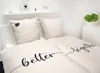 A neatly made bed with matching bedding and pillows. Produktbild-Vorschau