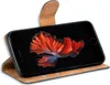 A flip case for a smartphone is shown open, displaying the phone's screen with a colorful image of a fish. Podgląd zdjęcia produktu