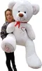 A woman is holding a large white teddy bear. Náhľad obrázku produktu