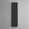 A tall, narrow black cabinet mounted on a gray wall. Anteprima dell’immagine prodotto