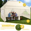 A family is enjoying a meal under a beige pop-up gazebo in a grassy garden. Náhľad obrázku produktu
