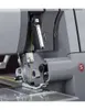 A close-up view of the needle and presser foot area of a sewing machine. Produktbild-Vorschau
