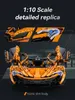 A detailed replica of an orange sports car with its doors open, presented with close-up insets and text highlighting its features. Anteprima dell’immagine prodotto