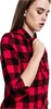 A woman is shown from the chest up, wearing a red and black checkered flannel shirt. Náhled obrázku produktu