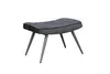 A dark gray upholstered ottoman with black piping and black metal legs is shown against a white background. Produktbild-Vorschau