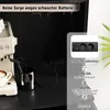 A close-up view of a kitchen appliance and a charging station integrated into a cabinet. Náhled obrázku produktu