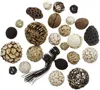 A collection of various decorative natural items, including pinecones, seed pods, and woven balls, arranged on a white background. Produktbild-Vorschau