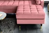 A close-up shot of a pink velvet ottoman with gold and black legs, part of a sectional sofa. Produktbild-Vorschau