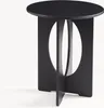 A black side table with a round top and an oval cutout in the base. Anteprima dell’immagine prodotto