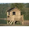 A wooden playhouse on stilts next to a body of water with trees in the background. Produktbild-Vorschau