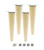 Four wooden furniture legs and accessories on a white background.
