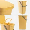 A collage of four images showing different views of a yellow plastic trash can with a lid and handle. Produktbild-Vorschau