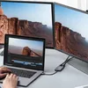 A laptop connected to two external monitors via a USB-C hub, with a person's hands on the keyboard. Produktbild-Vorschau