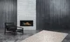 A modern living room with a fireplace, armchair, and rug. Produktbild-Vorschau
