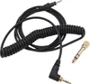 A coiled black headphone cable and a gold adapter are shown against a white background. Anteprima dell’immagine prodotto