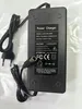A black power charger with its cable and plug. Podgląd zdjęcia produktu