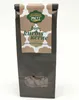 A dark brown paper bag with a label on the front, containing pumpkin seeds coated in dark chocolate. Produktbild-Vorschau
