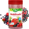 A product shot of a jar of instant tea drink with berries surrounding it. Produktbild-Vorschau