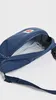 A close-up view of an open blue fanny pack, showing the interior mesh pocket. Voir les images du produit