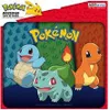 A marketing image for a Pokemon mousepad featuring the Kanto starters: Squirtle, Bulbasaur, and Charmander. Produktbild-Vorschau