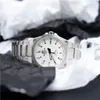 A silver Casio Edifice watch with a white face is displayed on a surface covered with crumpled black and white paper. Produktbild-Vorschau