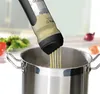 A kitchen scene with a pot of boiling water and vegetables in the background. Produktbild-Vorschau