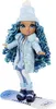 A doll dressed in winter clothing, standing on a snowboard. Náhled obrázku produktu
