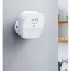 A white Eufy motion sensor is mounted on a light gray wall. Produktbild-Vorschau