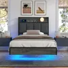 A bedroom scene featuring a bed with a headboard that has built-in charging and LED lighting. Produktbild-Vorschau