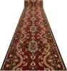 A long, patterned runner rug is shown from a low angle, extending into the distance against a white background. Produktbild-Vorschau