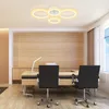 A modern office or study room with a desk, chairs, and a ceiling light. Voir les images du produit