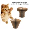 A kitten is shown next to two cardboard scratching posts for cats. The text suggests different shapes pique a cat's curiosity. Produktbild-Vorschau