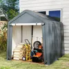 A storage tent filled with garden equipment and firewood next to a house. Produktbild-Vorschau
