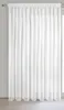 A white curtain hanging in front of a window. Produktbild-Vorschau
