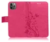 A pink flip case for a smartphone, decorated with a floral and butterfly pattern. Produktbild-Vorschau
