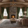 A cozy living room with a fireplace, Christmas tree, and sofa, decorated for winter. Voir les images du produit