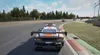 A racing game scene with multiple cars on a track. Produktbild-Vorschau