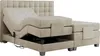 A beige adjustable bed with a tufted headboard, shown from a side-diagonal angle. Produktbild-Vorschau