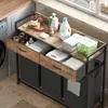 A laundry cart with drawers and baskets, placed in a laundry room setting next to a washing machine and a window. Produktbild-Vorschau