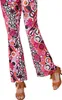 A close-up shot of a person's legs wearing colorful flared pants and fringe sandals. Produktbild-Vorschau
