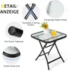 A small glass-topped folding table with a metal frame, decorated with a vase of flowers and a glass of drink. Produktbild-Vorschau