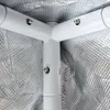 Close-up of the white metal frame of a grow tent, showing the junction of three poles and the reflective silver interior lining. Produktbild-Vorschau
