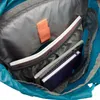 Close-up view of the inside of a blue backpack, showing notebooks and an orange velcro strap. Produktbild-Vorschau