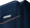 A close-up view of a navy blue suitcase, showing a metallic logo and a brown trim detail next to a zipper. Náhled obrázku produktu